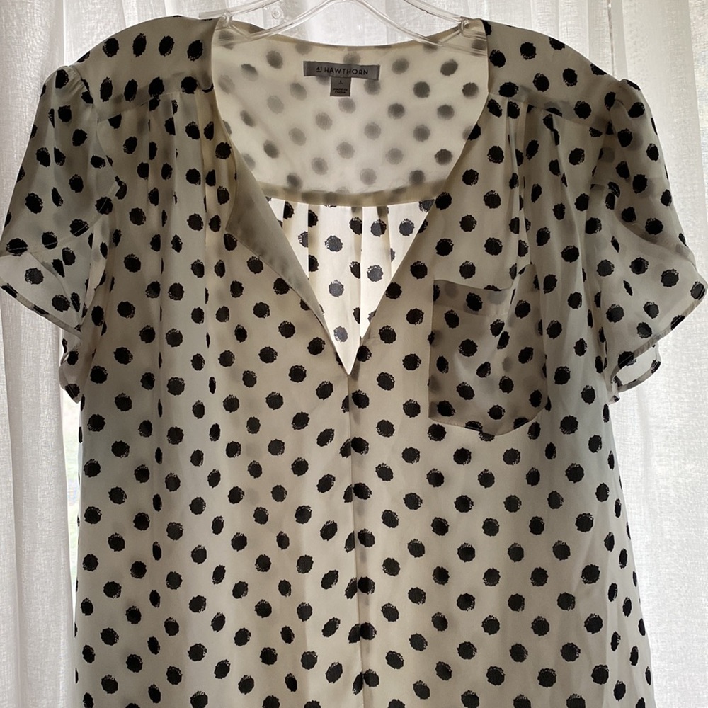 Black and white polka dot flutter sleeve blouse